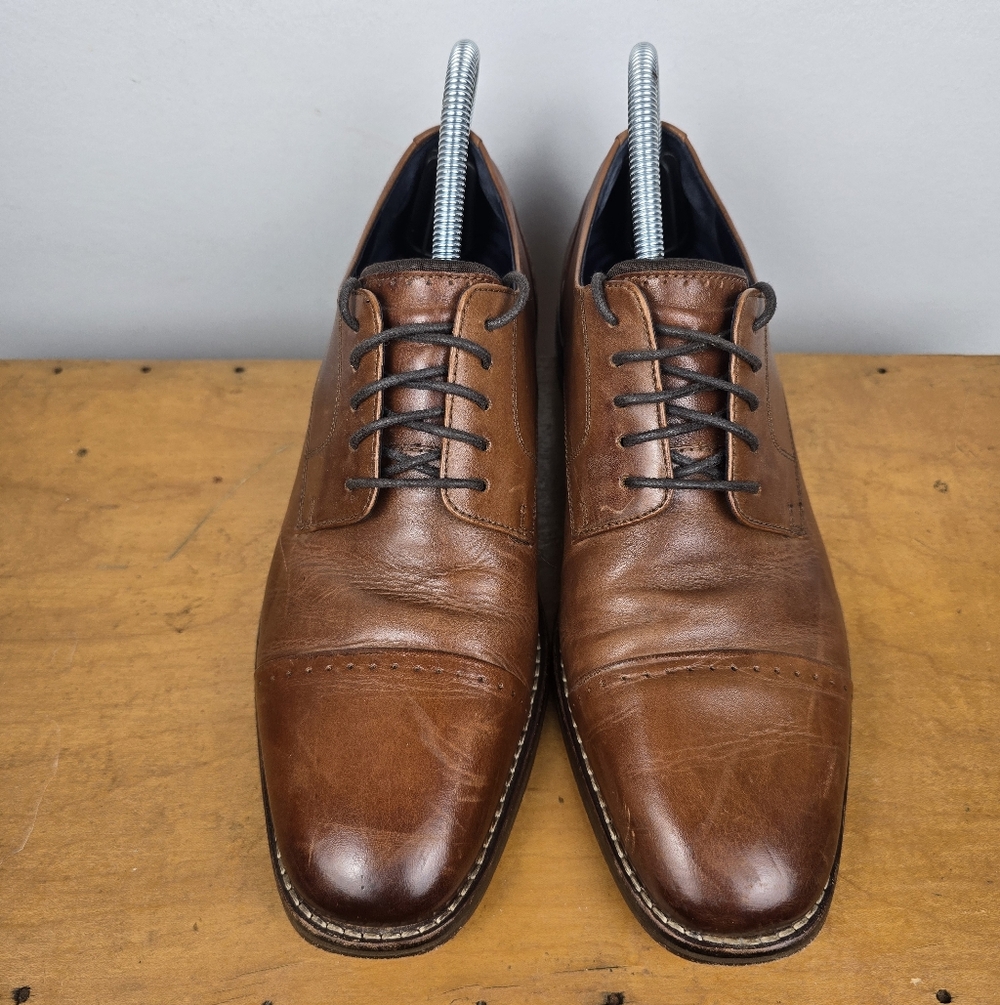 The COLE HAAN GRAND PRO Men's Brown Leather Dress Shoes